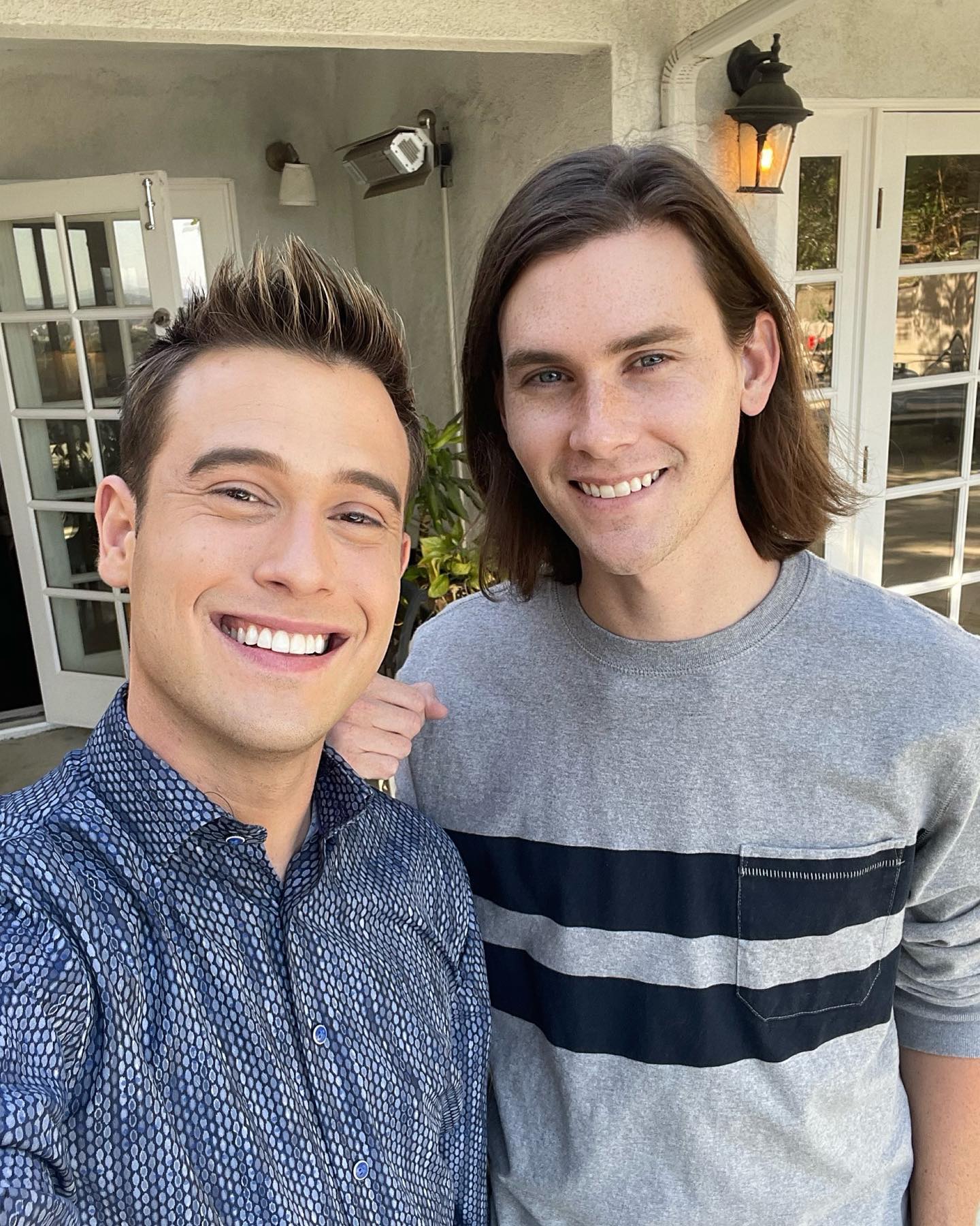 Tyler Henry and his boyfriend Clint Godwin taking a selfie together