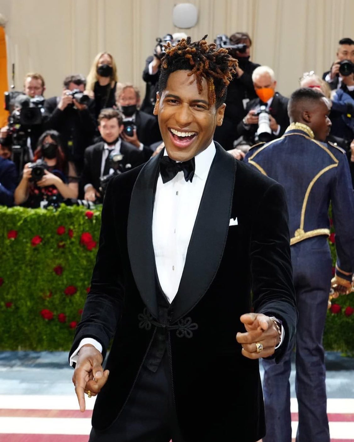 Jon Batiste wearing a tux at an event