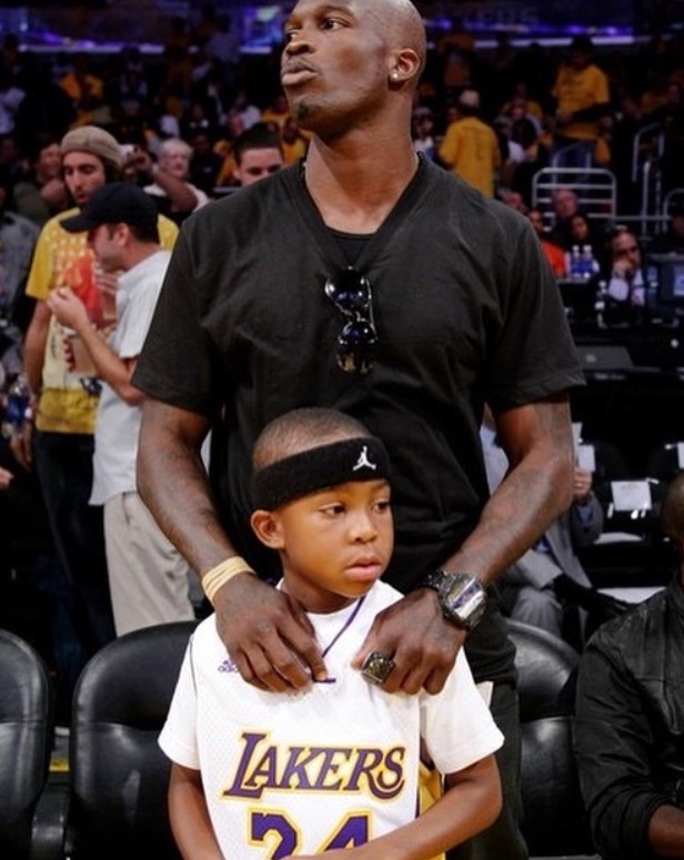 Chad Ochocinco with his son at a Lakers game