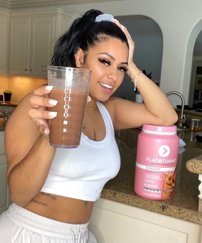 Carmen Pritchett smiling with a drink for Flat Tummy brand