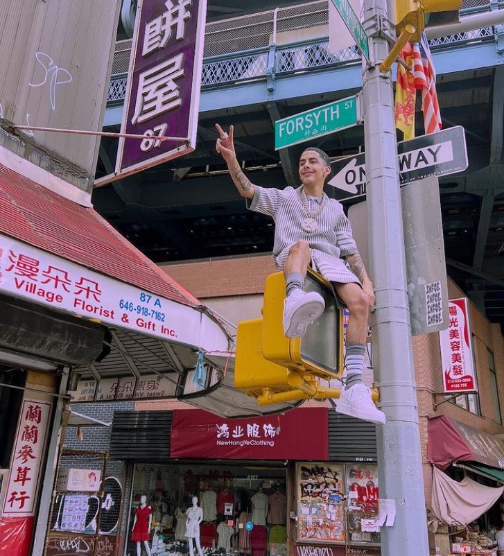 JI the Prince of NY, sitting on a traffic light at an intersection