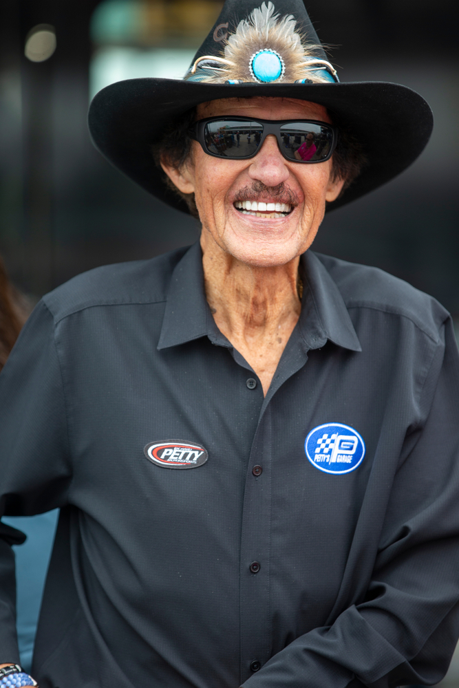 Richard Petty smiles for the cameras before a practice for the Ford 400