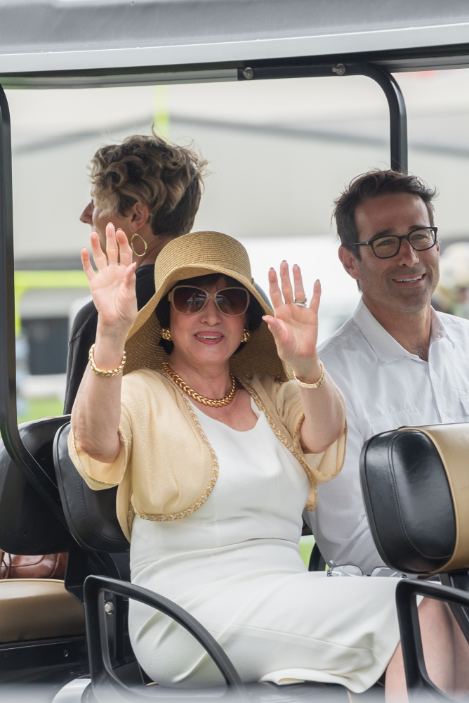 Gayle Benson riding golf cart