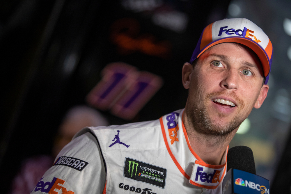Denny Hamlin (11) gets interviewed before practice for the Ford 400 at Homestead-Miami Speedway