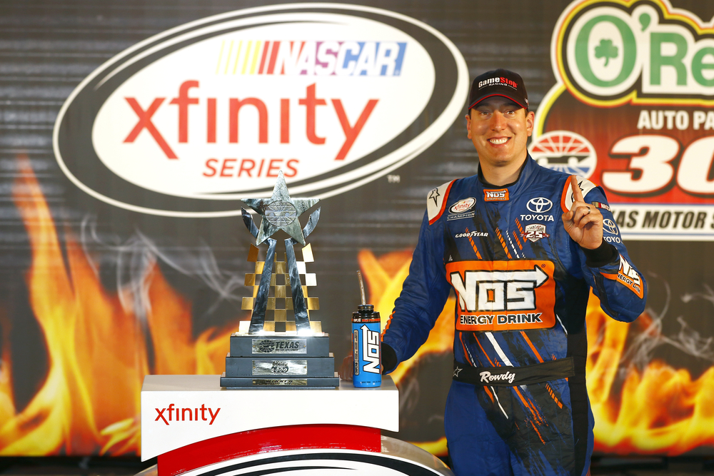 Kyle Busch celebrates after winning the O'Reilly Auto Parts 300