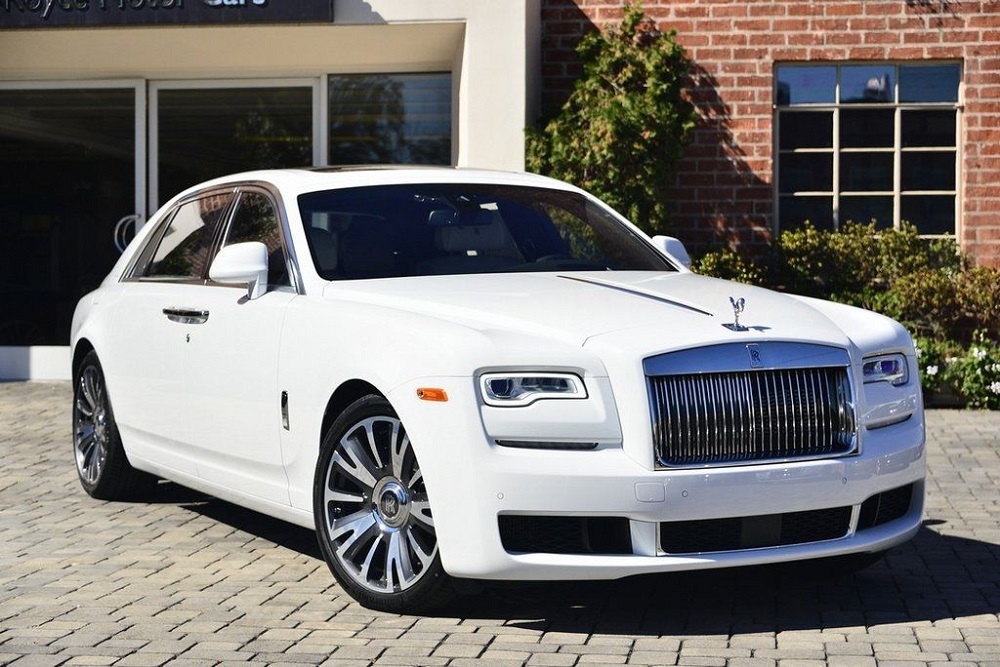rolls royce ghost car in white color parked at outdoor during day time