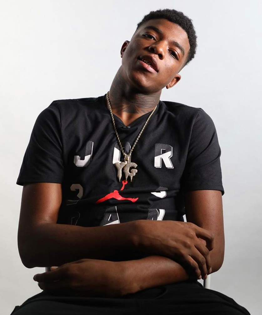 Yungeen Ace in a black tee against a light background