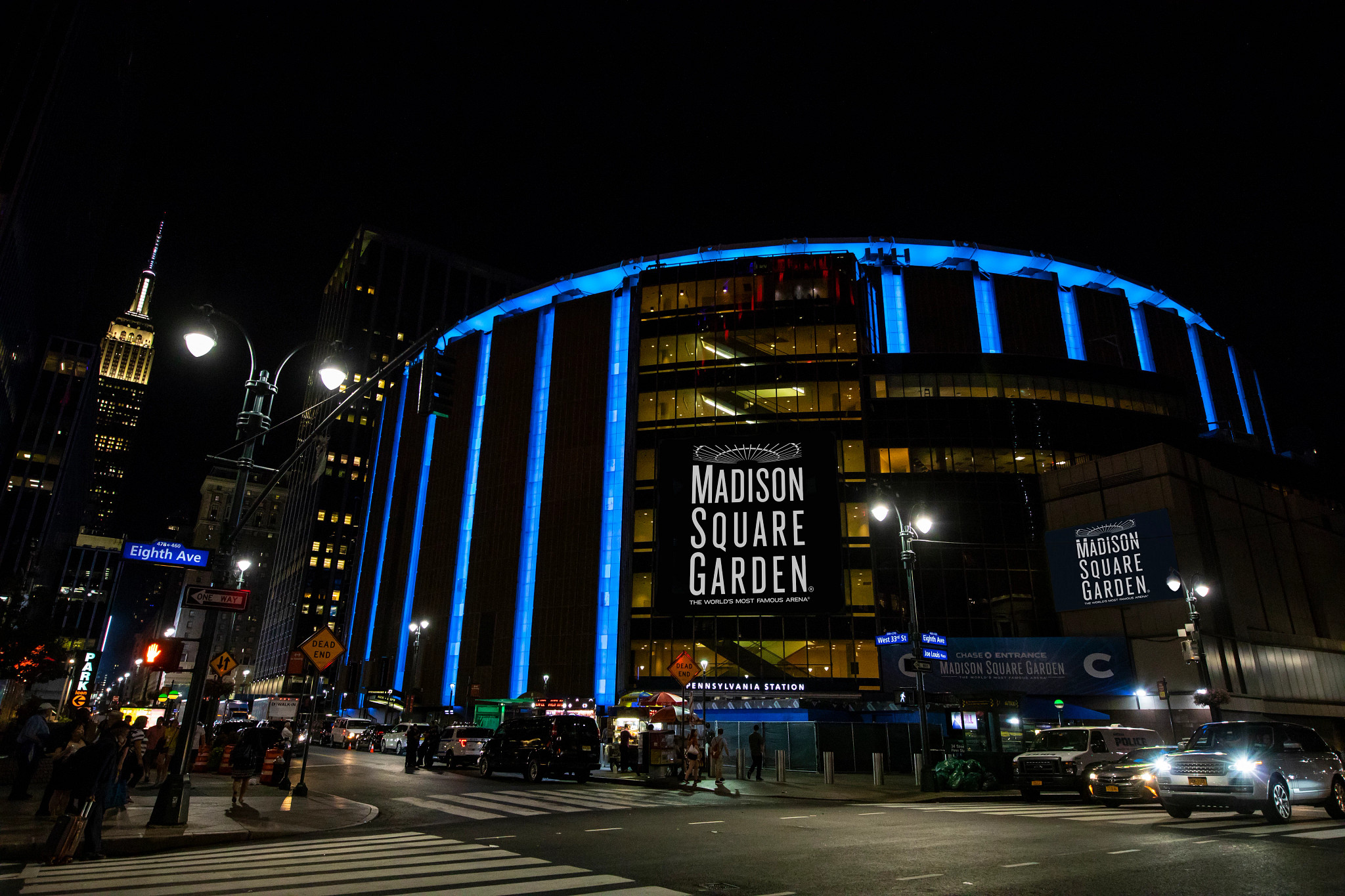 Madison Square Garden exterior lit up in the night sky.